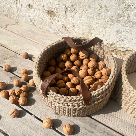 Beige crochet basket with leather handles