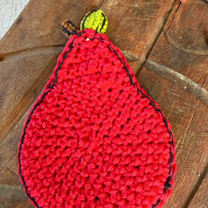 A red crocheted pear coaster - opposite side