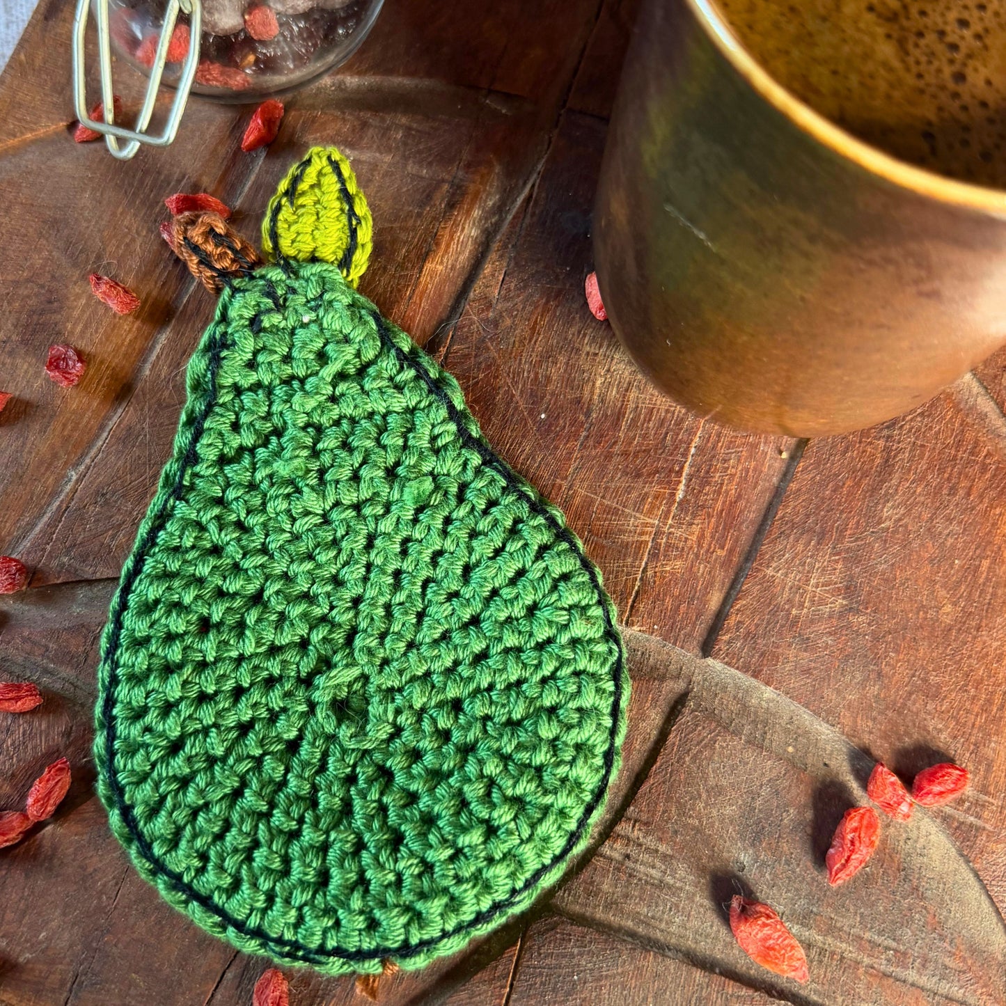 A green crocheted pears-opposite side