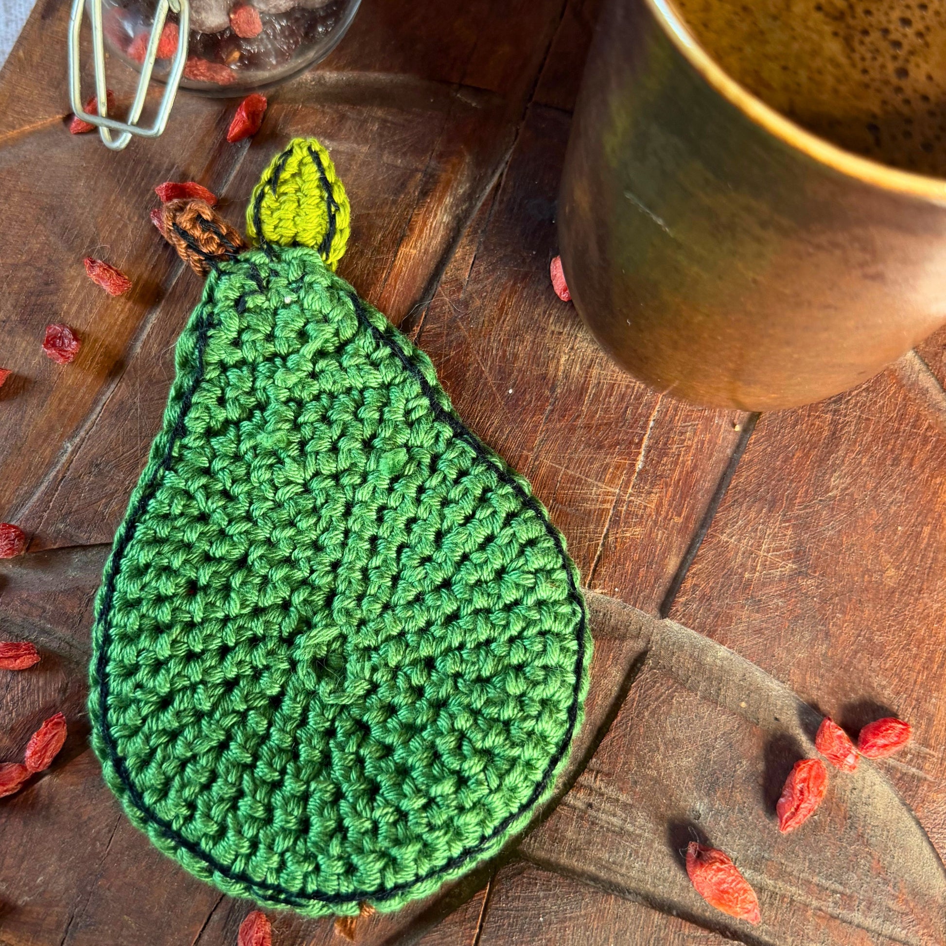 A green crocheted pears-opposite side