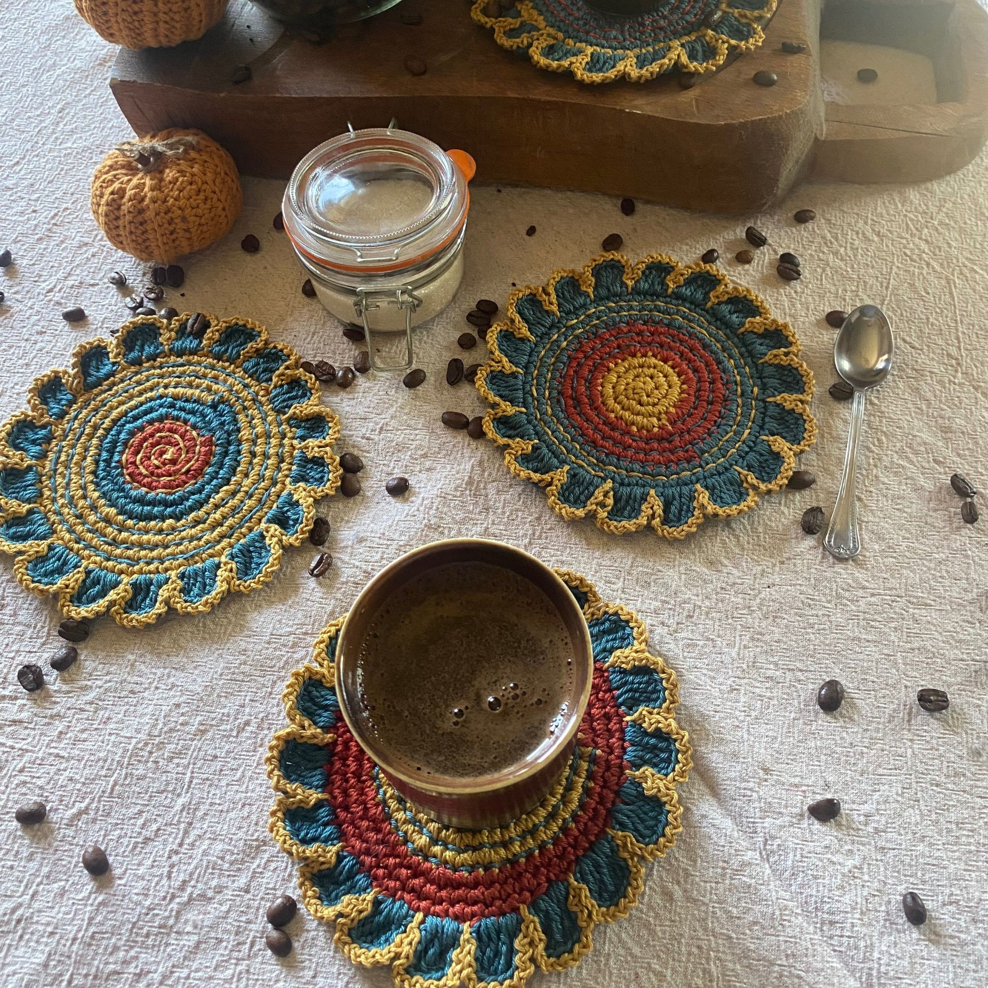 Handmade crochet flower coaster set of 4 in teal, yellow and rust