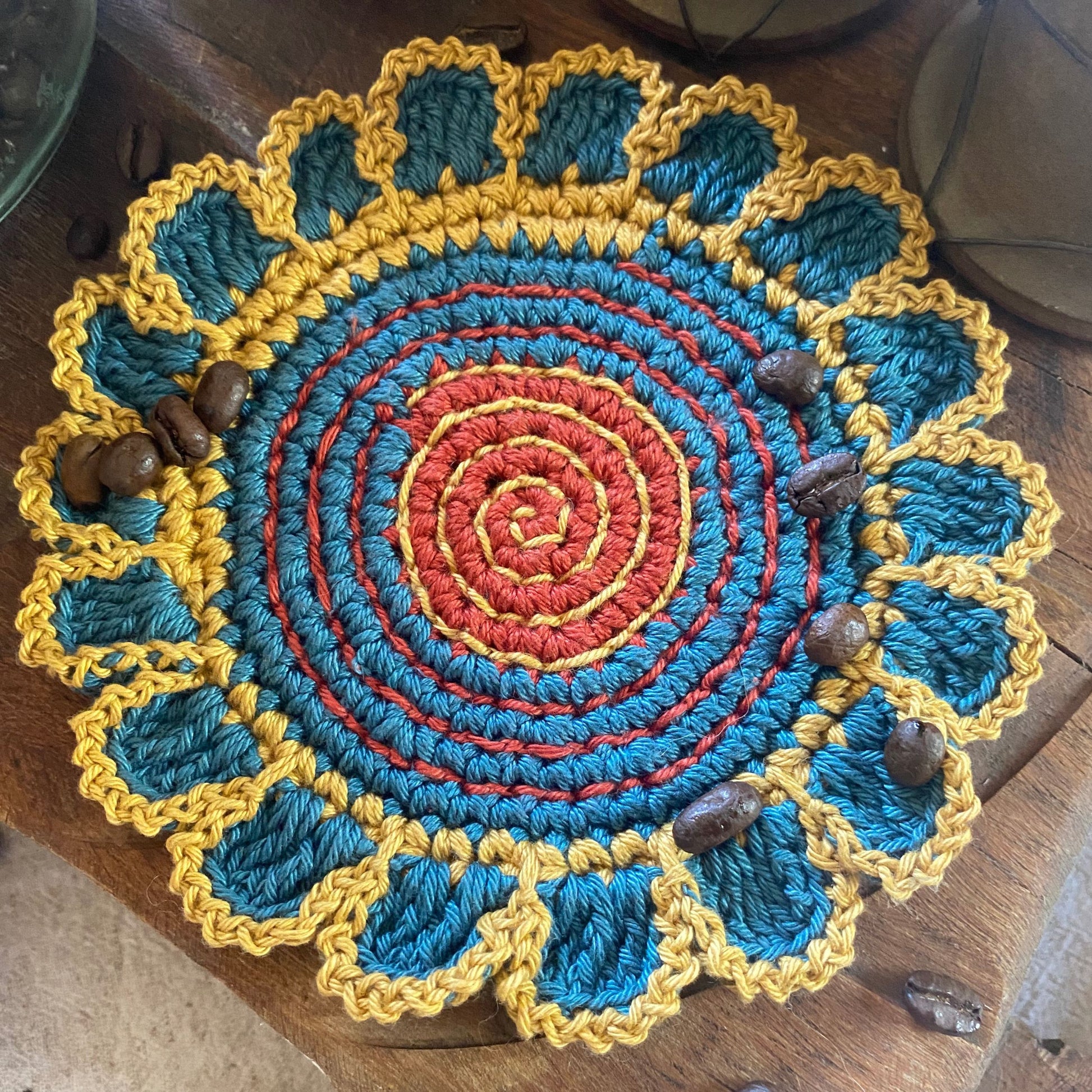 Crochet coaster detail, rust and teal – handmade cotton