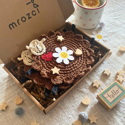 Brown crochet sheep mug rugs by Mrozci presented in an open branded gift box