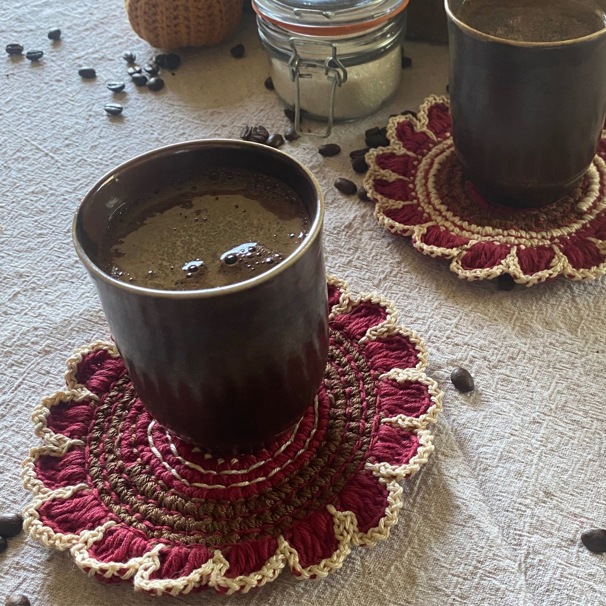 Cotton crochet flower coaster on table — boho decor
