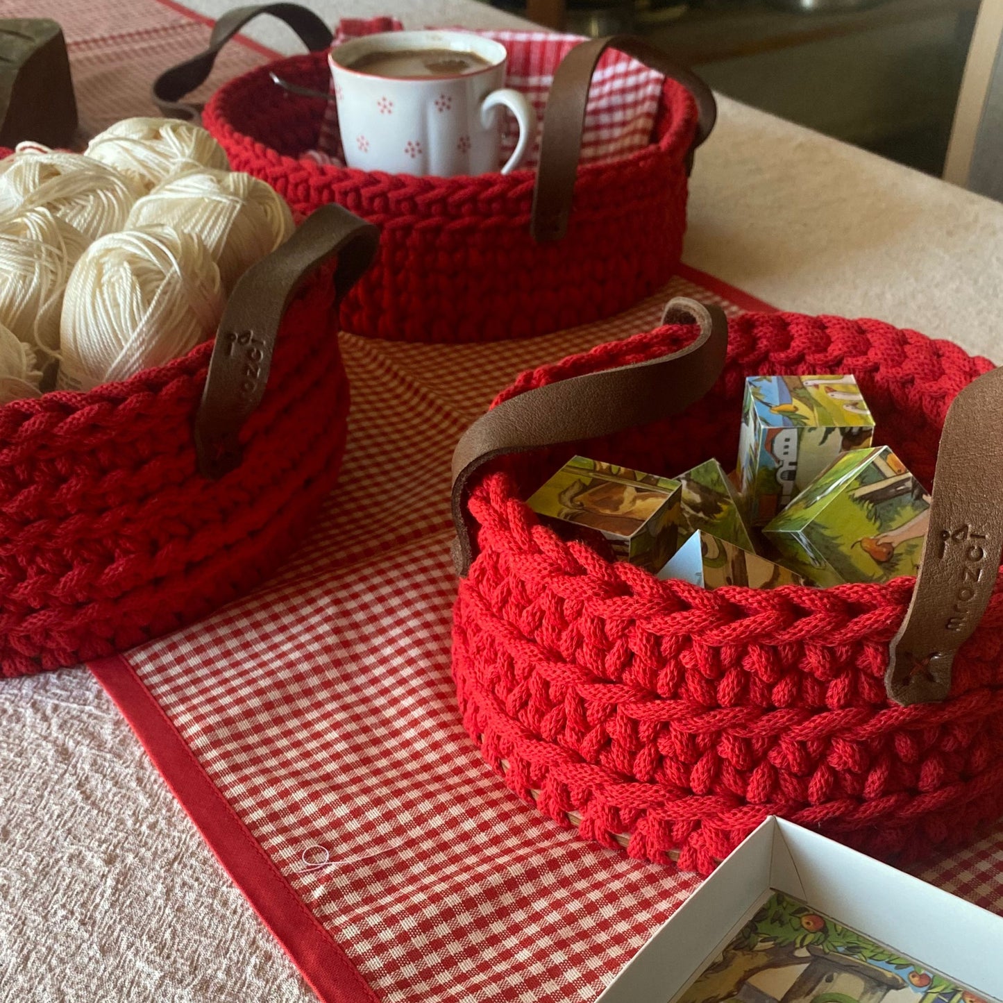 Red crochet basket with leather handles