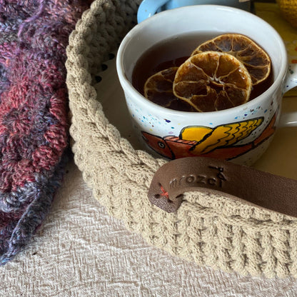 Handmade cotton cord basket, detail of leather handles