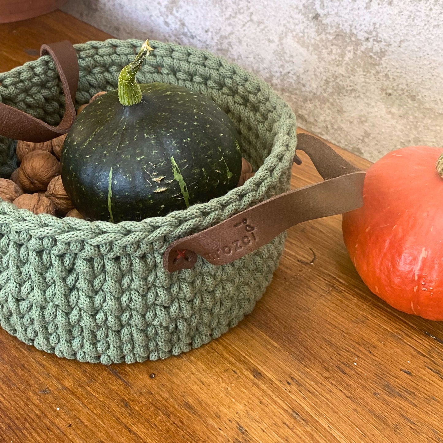 Handmade cotton cord basket, detail of leather handles