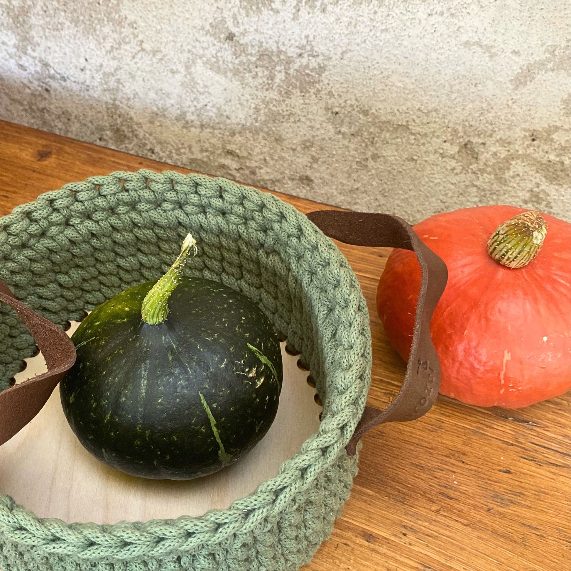 Crochet basket with solid plywood base, bottom view