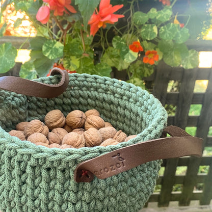Green crochet basket with leather handles
