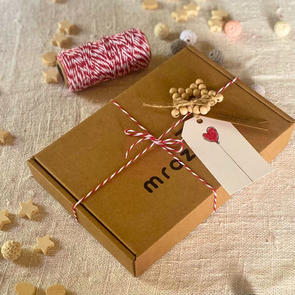 Kraft gift box with a decorative wooden ornament - star