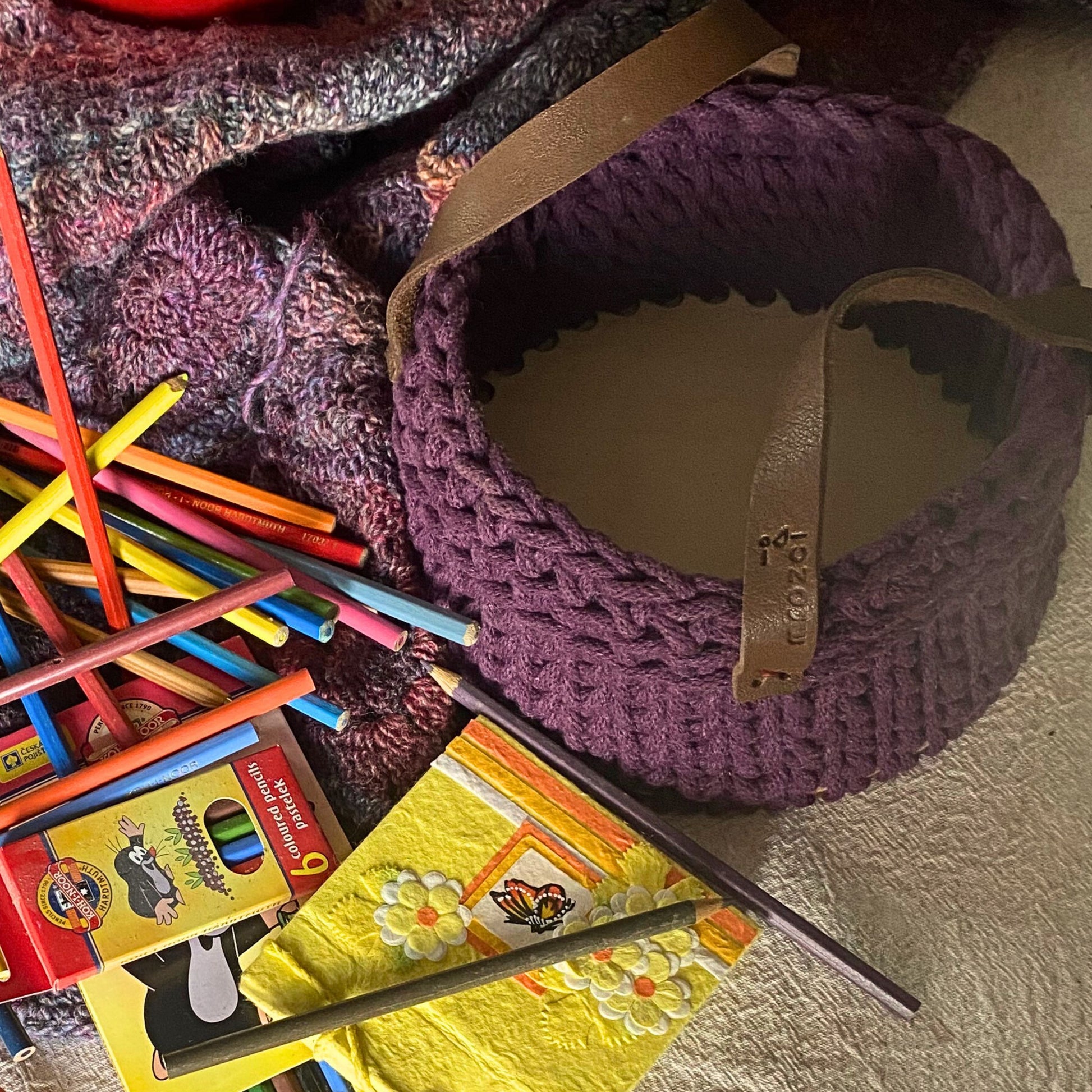 Handmade cotton cord basket, detail of leather handles