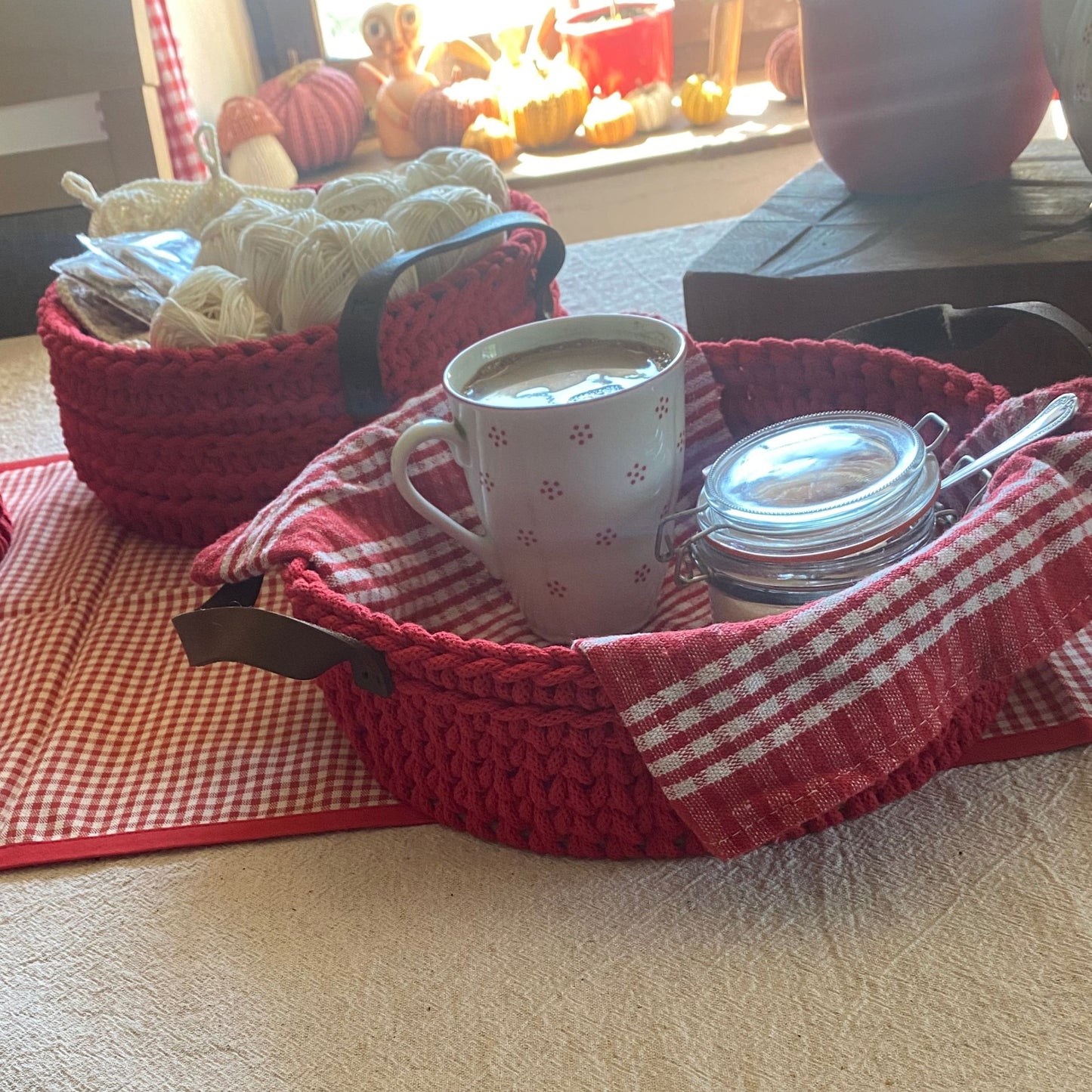 Red crochet tray with coffee on  table