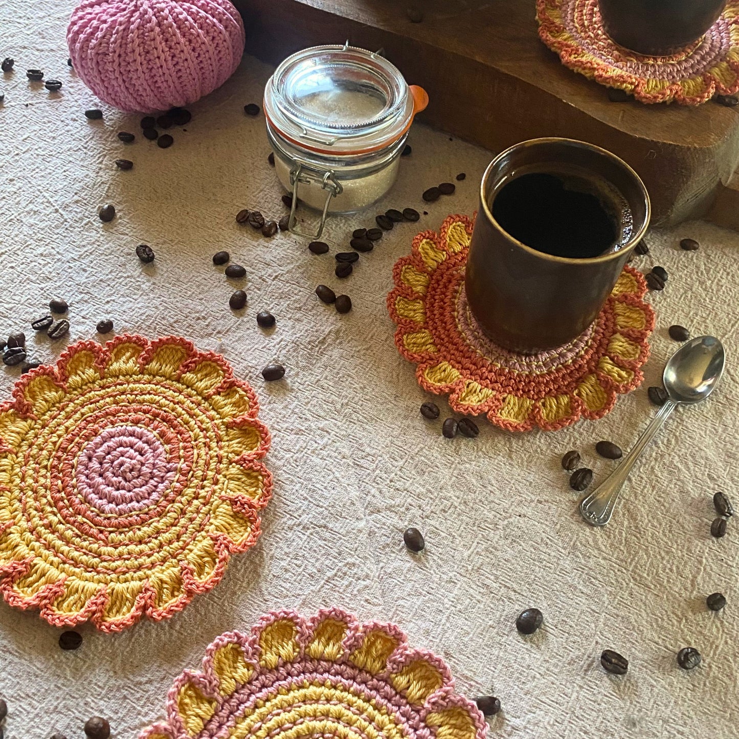 Cotton crochet flower coaster on table — boho decor