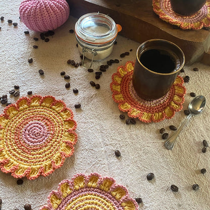 Cotton crochet flower coaster on table — boho decor